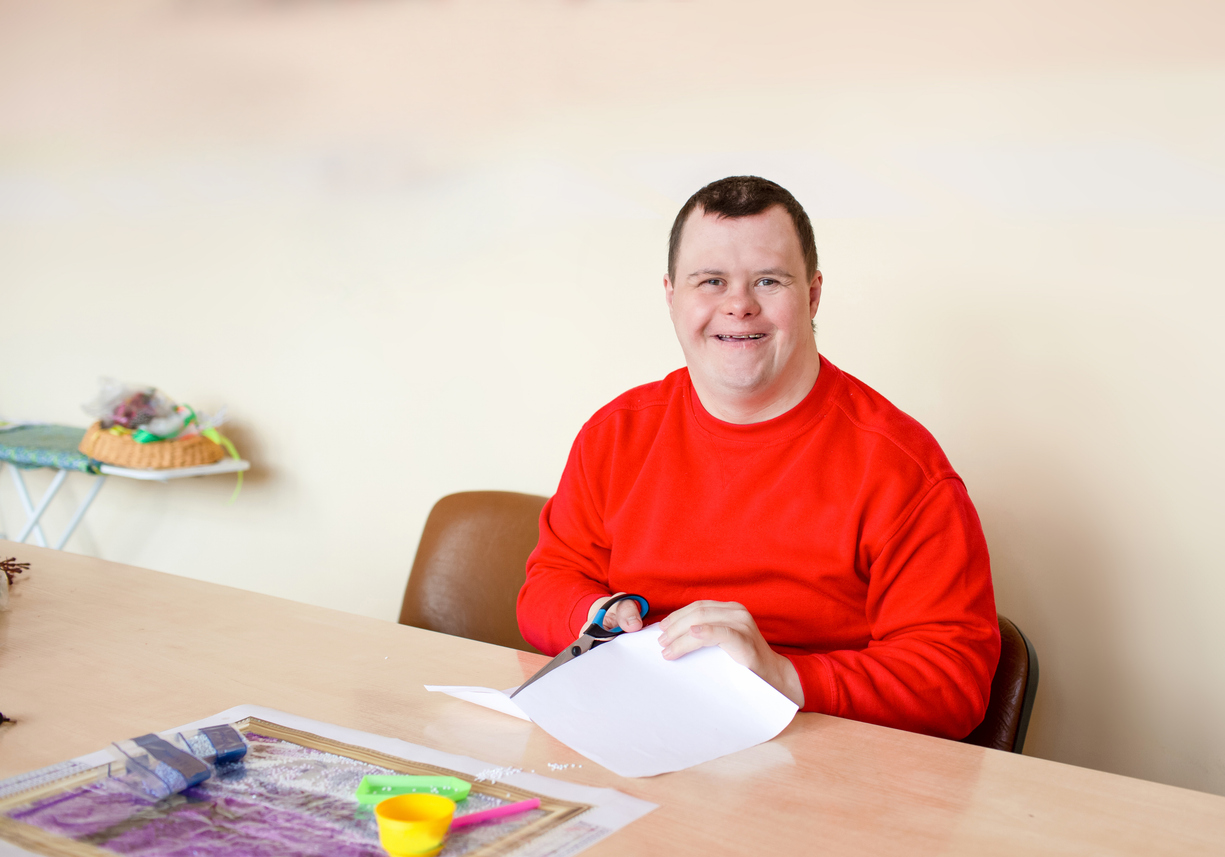 a guy with down syndrome does needlework